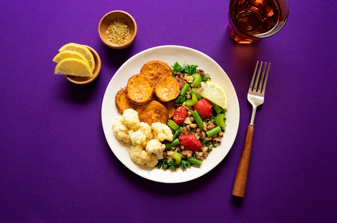 Muscle Growth Meal Plan cover showing a balanced plate, dumbbells, a grocery list, and a progress chart