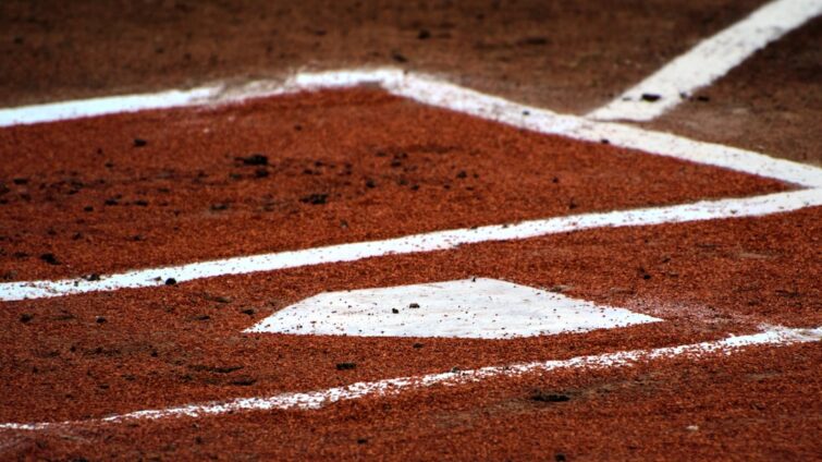 Cover image for youth baseball practice plan with diamond diagram, stopwatch, cones, and tee, emphasizing a 90-minute template and drills