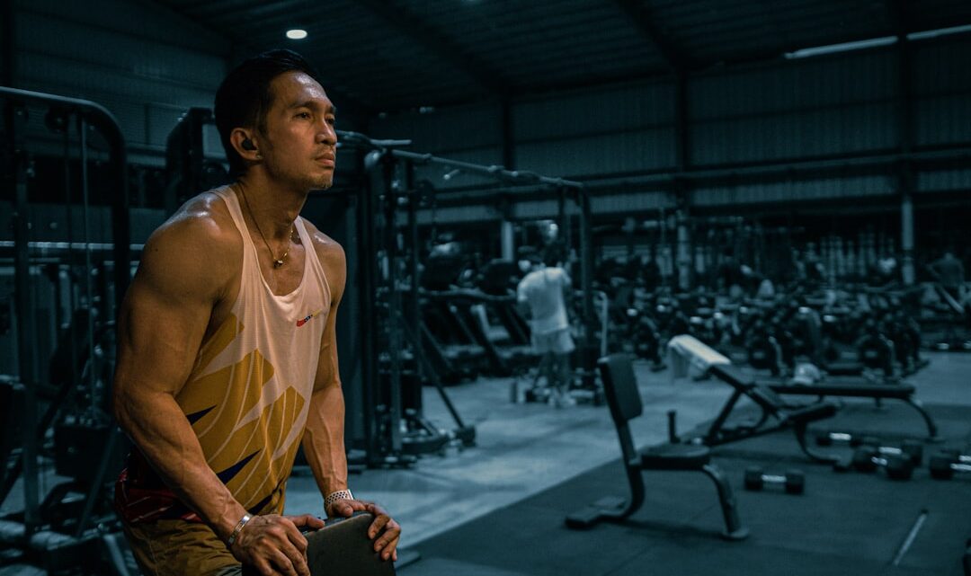 muscle recovery after training cover image with a lifter resting beside a simple weekly routine checklist