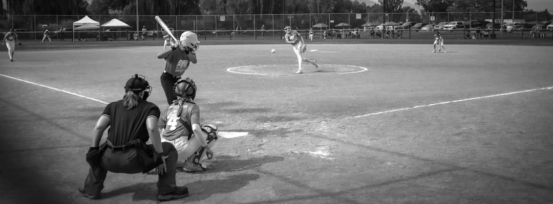 Youth Baseball Coaching cover illustration with a coach, kids, and practice cones