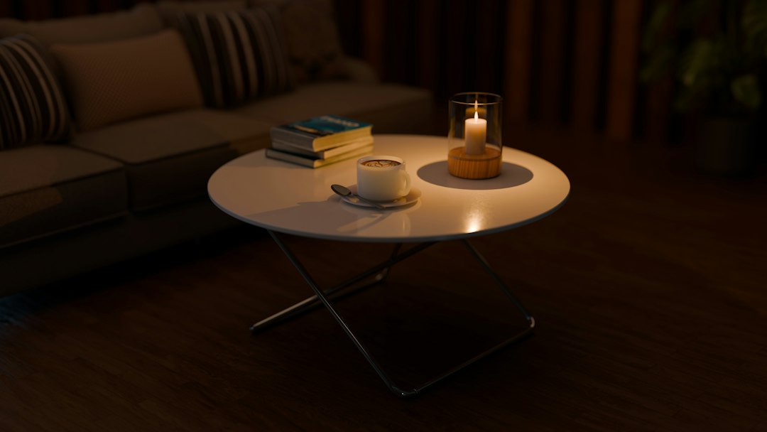 Cozy scene with tea, book, warm lamp, and phone set aside to signal an evening relaxation routine