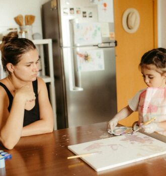 Cover illustration for emotional regulation for parents showing a calm parent guiding a child through a simple breathing routine at home