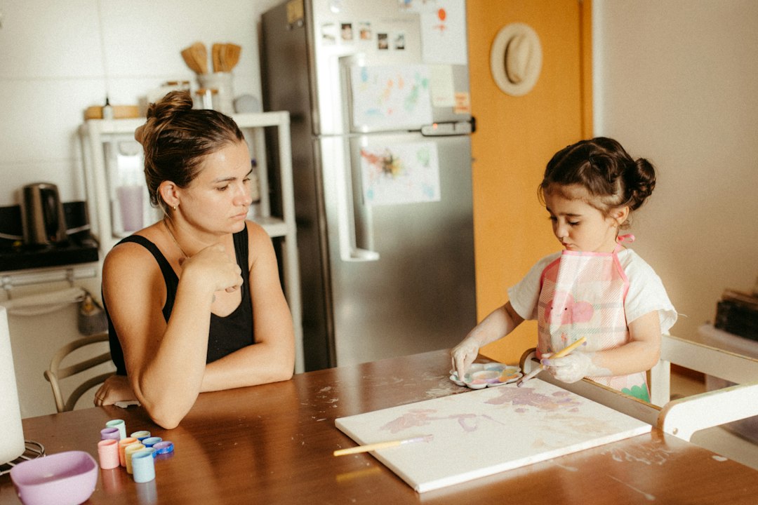 Cover illustration for emotional regulation for parents showing a calm parent guiding a child through a simple breathing routine at home